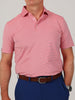 A person wearing a pink and blue striped polo shirt, blue pants, and a brown belt. The tone is casual, with a neutral expression visible.