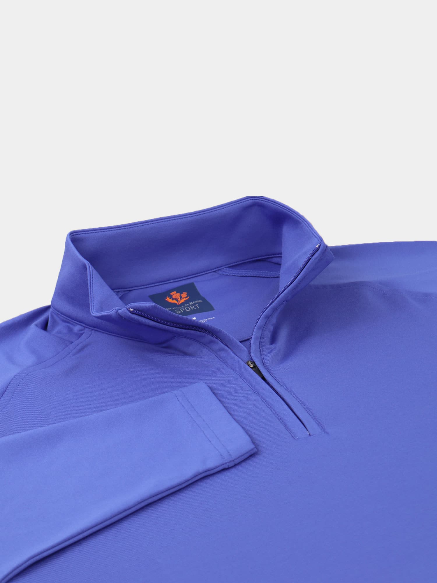 Royal blue quarter-zip golf pullover with a stand-up collar, neatly folded