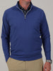 A mid-weight 1/4 zip performance pullover in denim blue with a mock neck and signature Donald Ross styling.