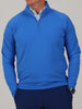 A mid-weight 1/4 zip performance pullover in azure blue featuring four-way stretch and a tailored sport fit.