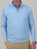 A mid-weight 1/4 zip performance pullover in coastal blue designed for lightweight layering and on-course comfort.
