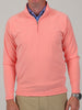 A mid-weight 1/4 zip performance pullover in nectar orange featuring moisture-wicking technology and a mock neck.