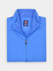 Folded bright blue quarter-zip performance vest for golfers