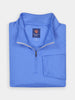 A folded, blue quarter-zip pullover with a woven texture, featuring performance moisture-wicking fabric