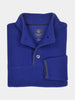 Folded royal blue fleece pullover with a high collar and button detail, featuring a label inside