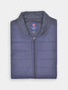 Folded navy quilted jacket with a zip, high collar, and Donald Ross Sportswear label