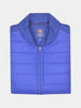 Folded royal blue quilted jacket with a visible label inside the collar