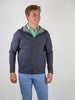 Young man wearing a navy hooded jacket with gray trim and a green patterned shirt underneath, paired with light blue pants, standing against a white background.