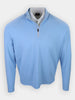 Light blue long-sleeve pullover with a zipper neck and a white collared shirt underneath.