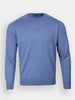 Light blue long-sleeve crewneck sweater against a plain background, featuring a soft texture and ribbed cuffs