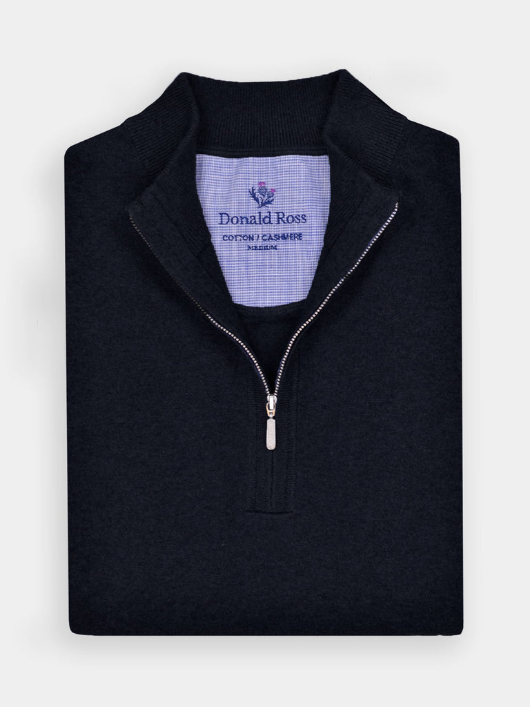 Folded men's black quarter-zip sweater by Donald Ross, featuring a ribbed mock neck collar and silver zipper closure