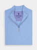 Light blue half-zip sweater folded neatly with a ribbed collar, silver zipper, and visible label