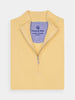 Yellow half-zip sweater folded neatly, showcasing its ribbed collar and silver zipper