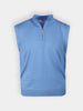 Light blue sleeveless sweater vest with a high collar and quarter-zip design. The fabric appears soft and slightly textured against a plain background.