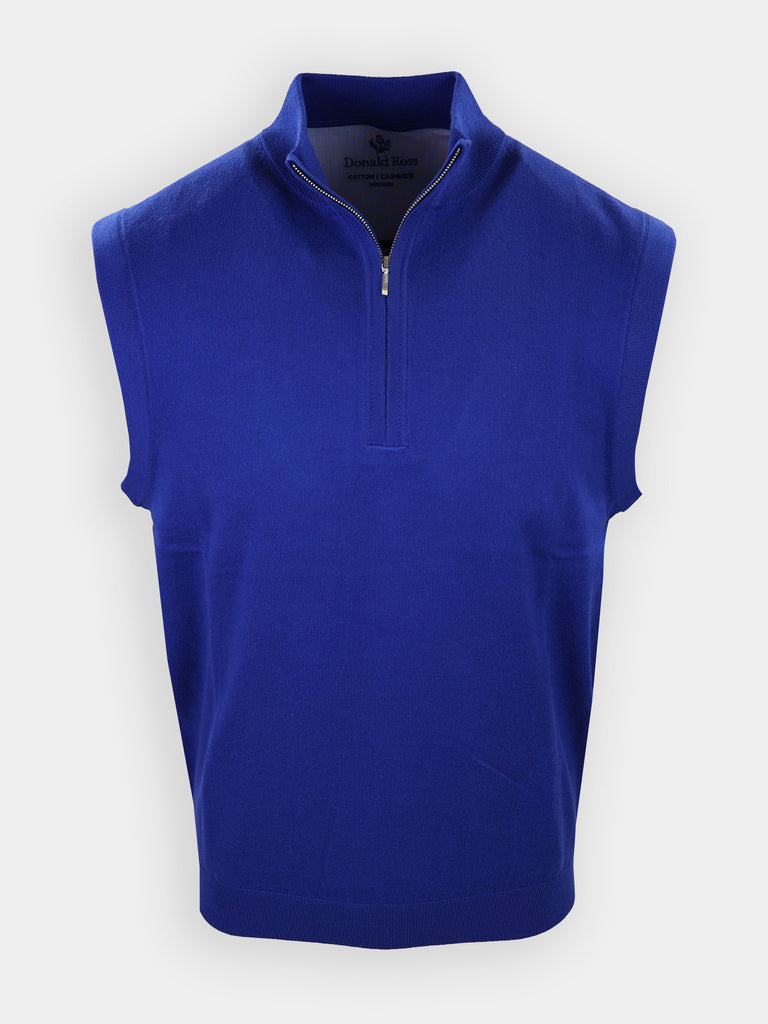 A sleeveless blue golf sweater features a zippered neck and a solid knit design.
