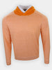 A striped, orange sweater with a hood is displayed against a plain background.
