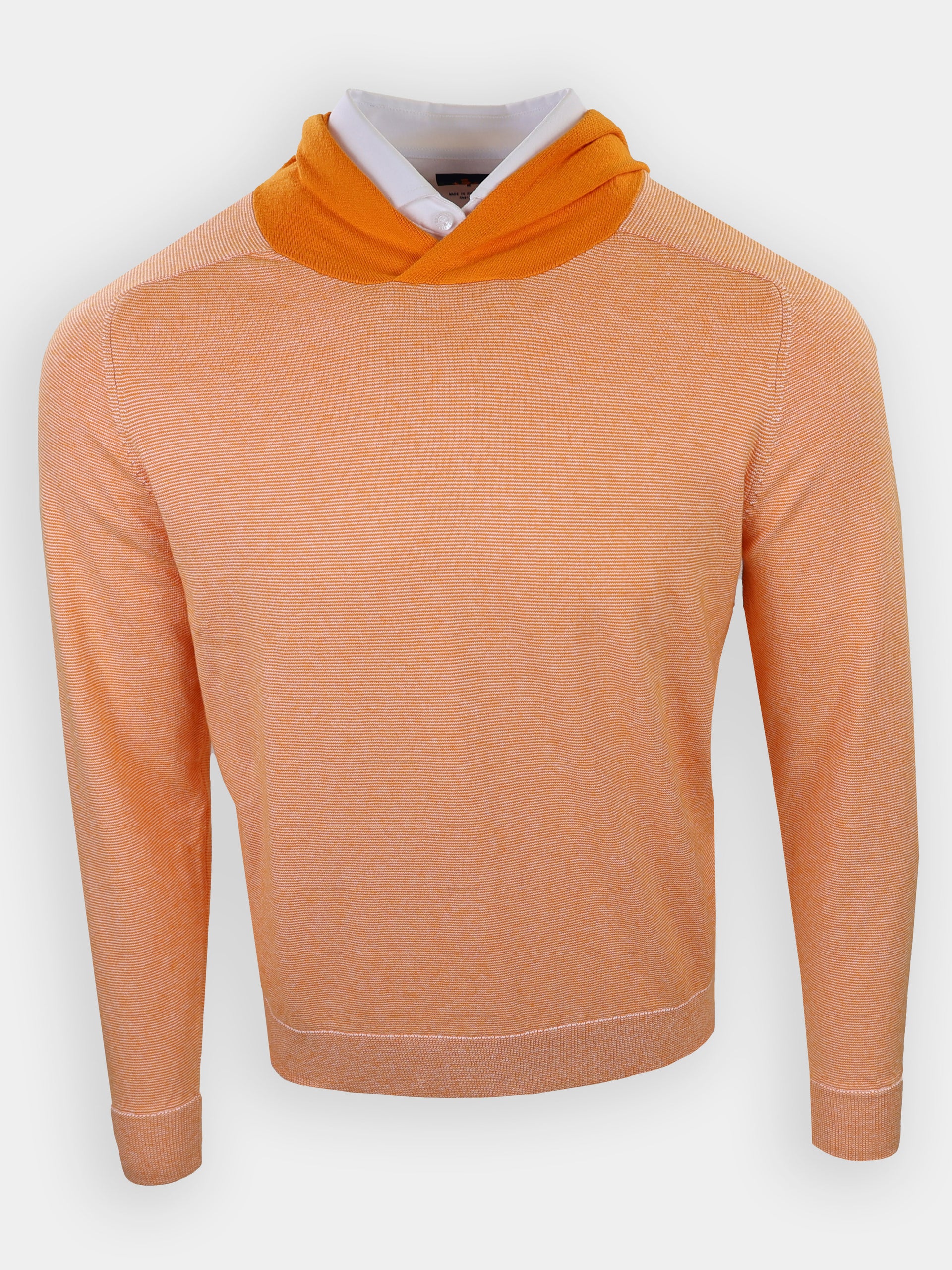 A striped, orange sweater with a hood is displayed against a plain background.