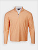 Orange quarter-zip pullover with long sleeves, showcasing a soft fabric texture. The collar reveals a white shirt underneath, conveying a casual yet polished style