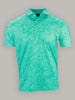 Turquoise polo shirt with an intricate floral pattern, featuring a buttoned collar. The shirt is set against a plain grey background, conveying a casual yet elegant tone.