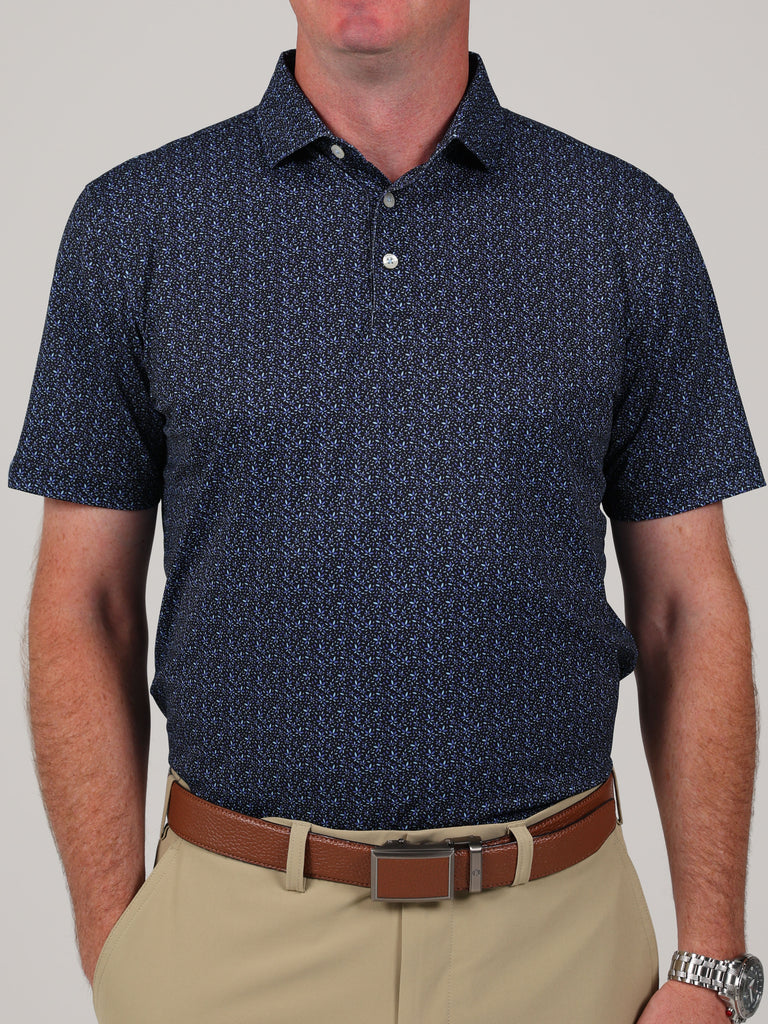 Simon baby pique floral print, a golf polo featuring a navy blue shirt and tan pants