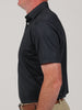 Simon baby pique floral print, a golf polo featuring a black shirt and tan pants