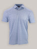 A short-sleeved, light blue polo shirt with a floral pattern is displayed against a neutral background.