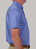 Man in profile wearing a blue patterned short-sleeve shirt and khaki pants. The tone is neutral, highlighting the clothing style.