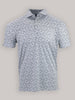 A white short-sleeve polo shirt with a subtle black football print pattern on a plain gray background. The shirt is neatly folded and exudes a casual vibe.