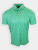 Short-sleeve green polo shirt with a leaf pattern is displayed against a white background.