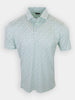 Short-sleeved, light green polo shirt with a floral pattern.