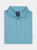 Folded blue polo shirt with ornate white pattern, featuring a "Donald Ross Sport" label on the collar