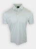 A short-sleeved polo shirt with a white base and green polka dots is displayed against a plain background.
