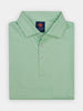 Light green polo shirt with fleur de lis pattern, folded neatly, featuring a collar and branded label at the neckline