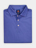 Folded blue polo shirt with a red fleur de lis pattern, buttoned down with three white buttons. The collar is neatly folded, conveying a fresh and sporty style.