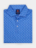 Blue patterned polo shirt neatly folded, featuring a subtle skull design