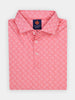 Hot pink patterned polo neatly folded, showcasing understated skull silhouettes
