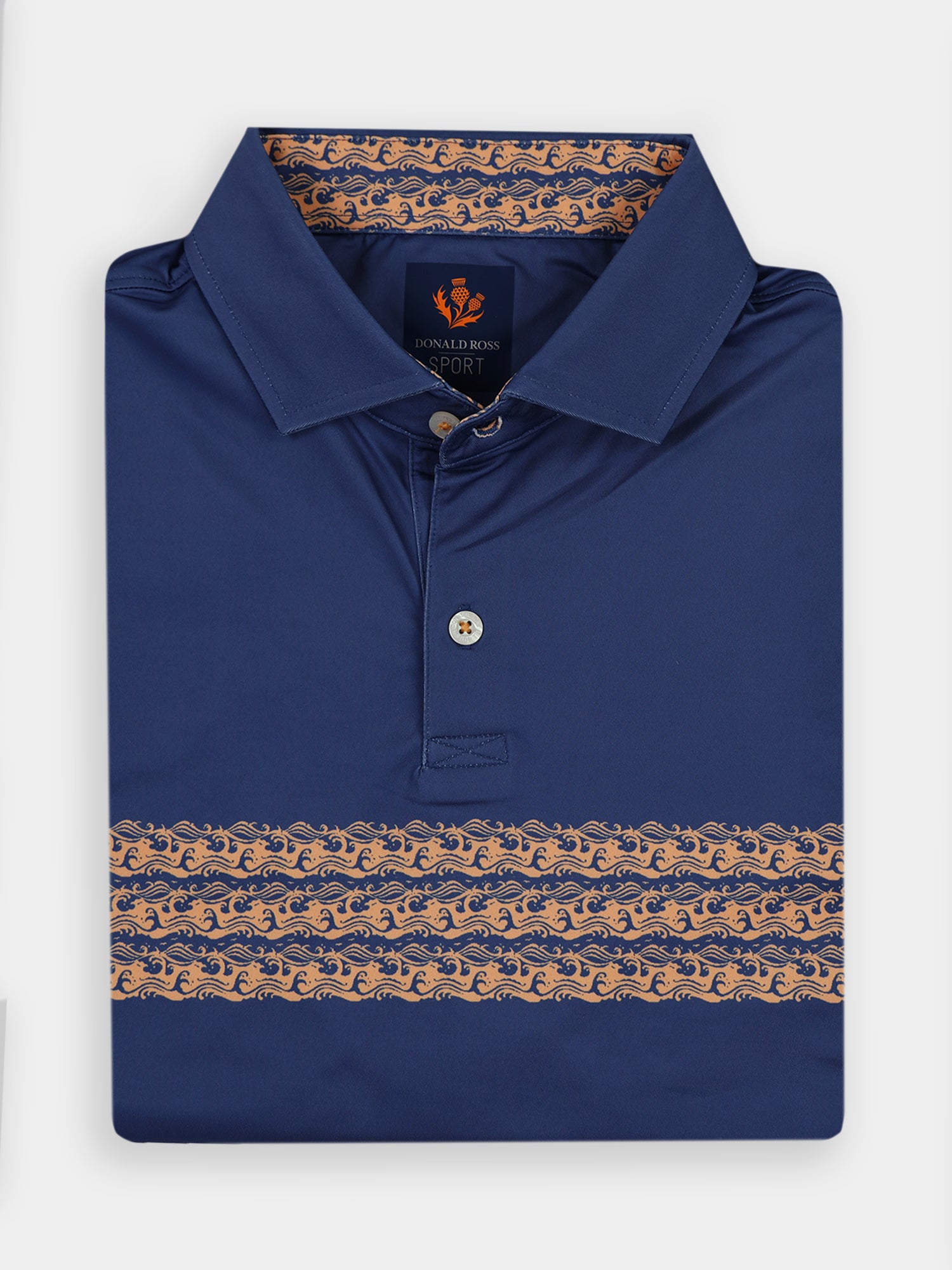 Navy blue polo shirt neatly folded, featuring a beige wave pattern across the chest