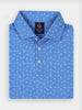 Blue collared shirt with white palm tree and pineapple patterns, neatly folded