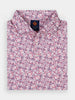 Folded floral men's polo shirt with a vibrant pink and navy pattern