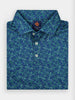 Folded blue and green patterned polo shirt with a small geometric design