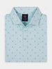 Teal polo shirt with small navy golf flag patterns, folded neatly