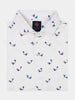 White polo shirt with a colorful magic lamp pattern. The shirt has a Donald Ross Sport label and red cross-stitched buttons.