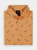 Folded orange golf polo shirt with a small golfer print pattern in various colors