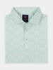 Folded white polo shirt with scattered green patterns depicting baseball elements