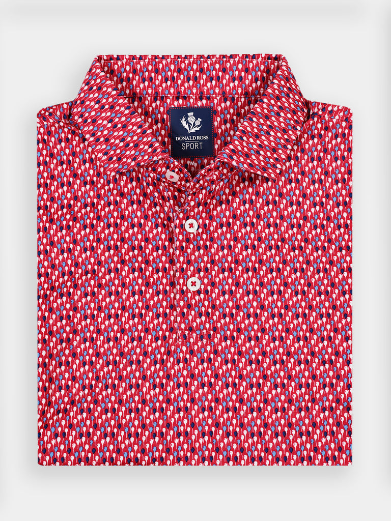 Red and white patterned polo shirt with a dense repeating abstract balloon design