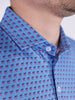 Close-up of a blue golf polo shirt featuring a repeating pattern of democrat donkeys in red and blue