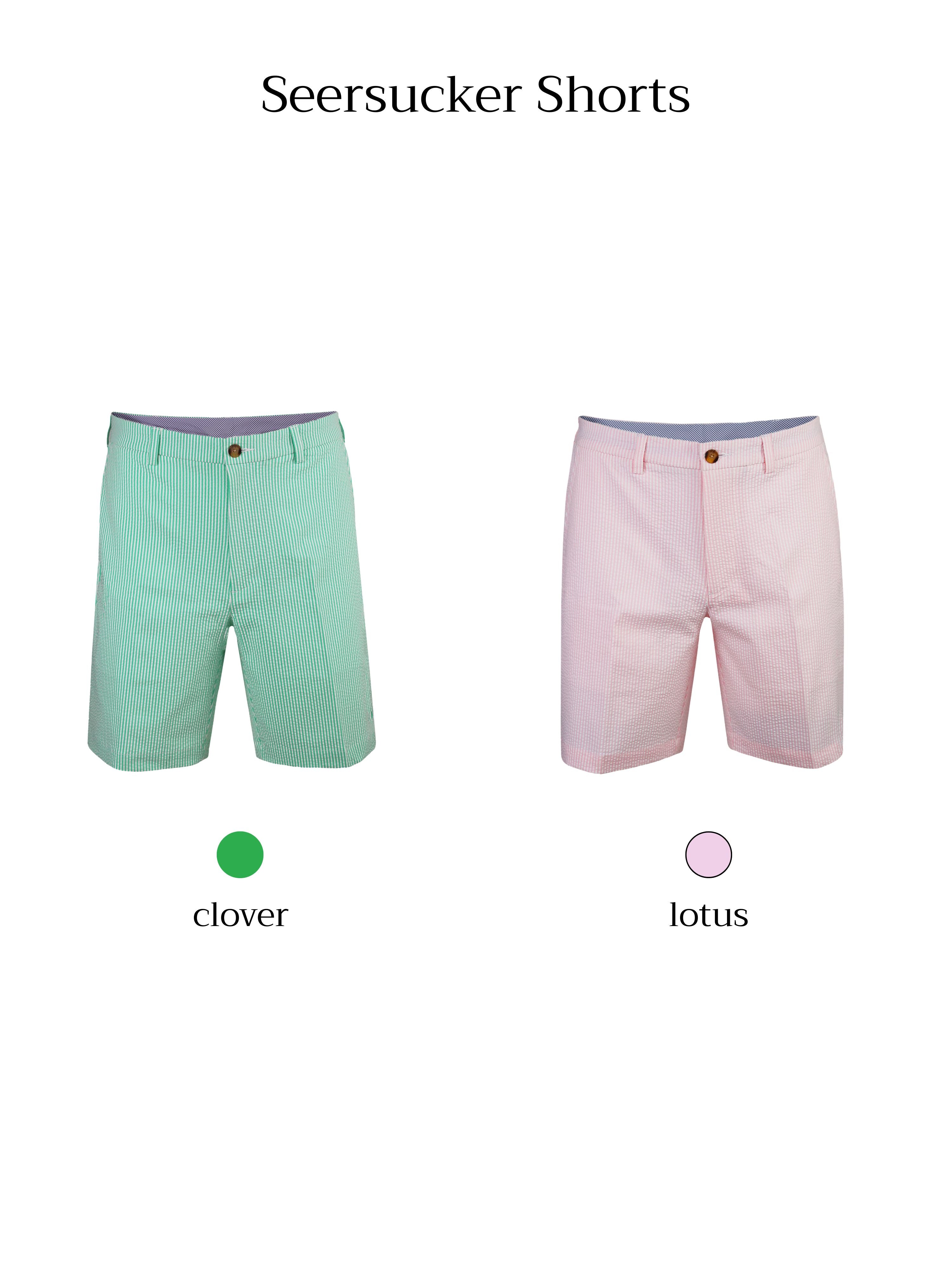 Two pairs of seersucker shorts are displayed side by side, one in green with white stripes and the other in pink with white stripes.