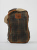 Plaid golf shoe bag with earthy tones and brown leather accents. Features a leather patch with branding and a beige strap, creating a rustic, vintage look