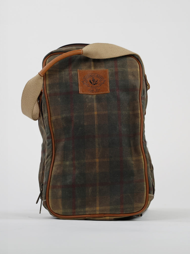Plaid golf shoe bag with earthy tones and brown leather accents. Features a leather patch with branding and a beige strap, creating a rustic, vintage look