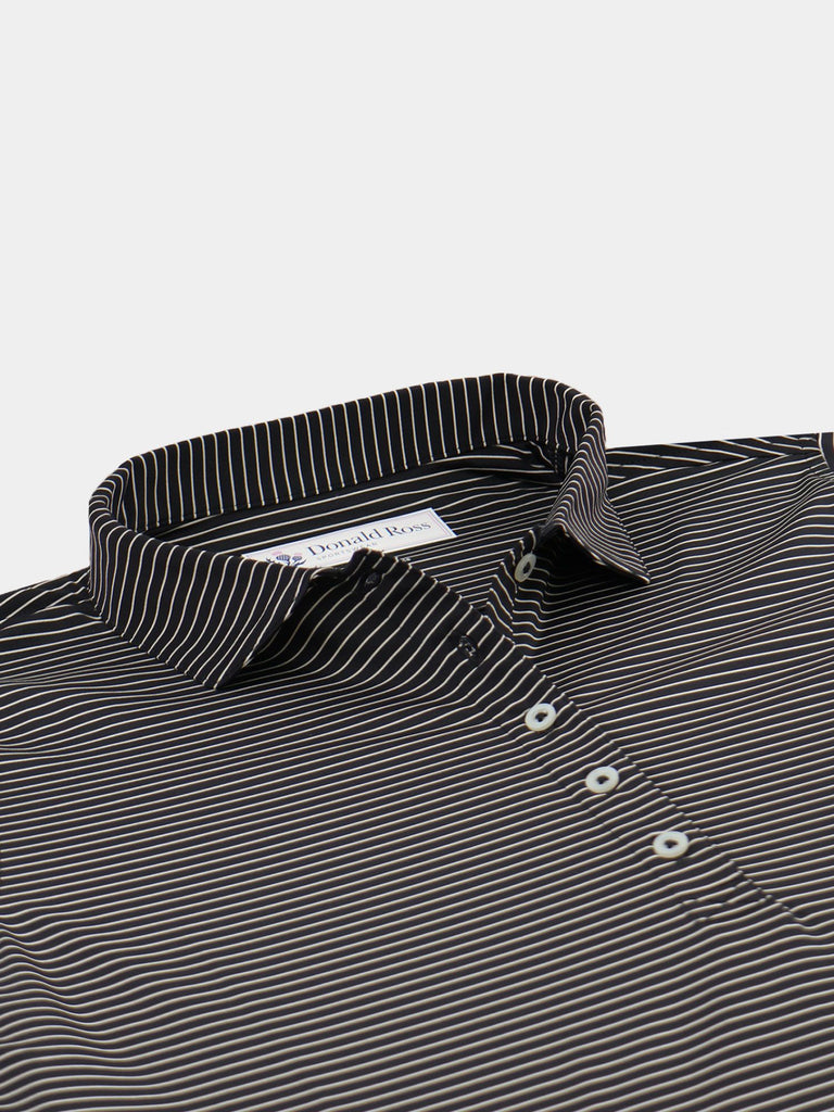 Black and white striped dress shirt with mother-of-pearl buttons displayed on a folded presentation.